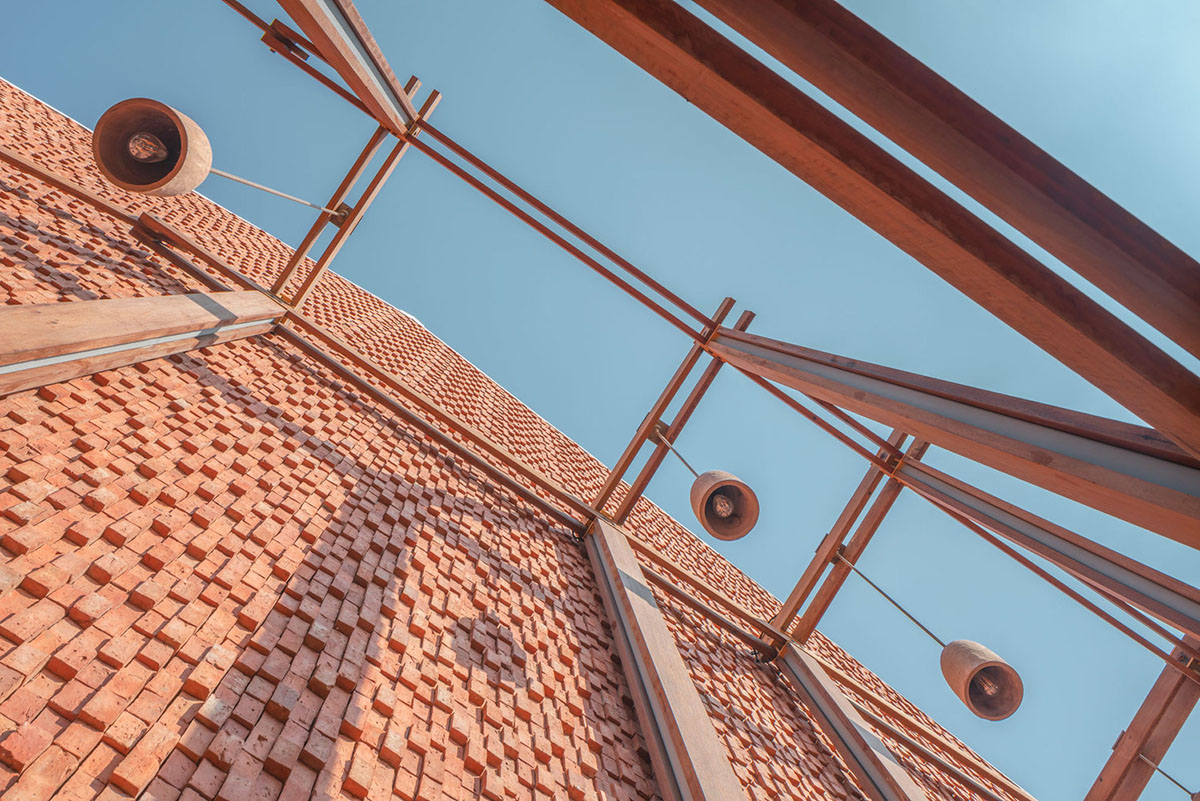 onion designs hotel and restaurant with handmade orange bricks in Thailand