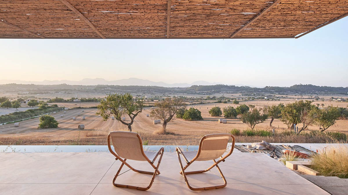 OHLAB's rural villa in Mallorca allows guests to frame natural surrounding under wattle pergola