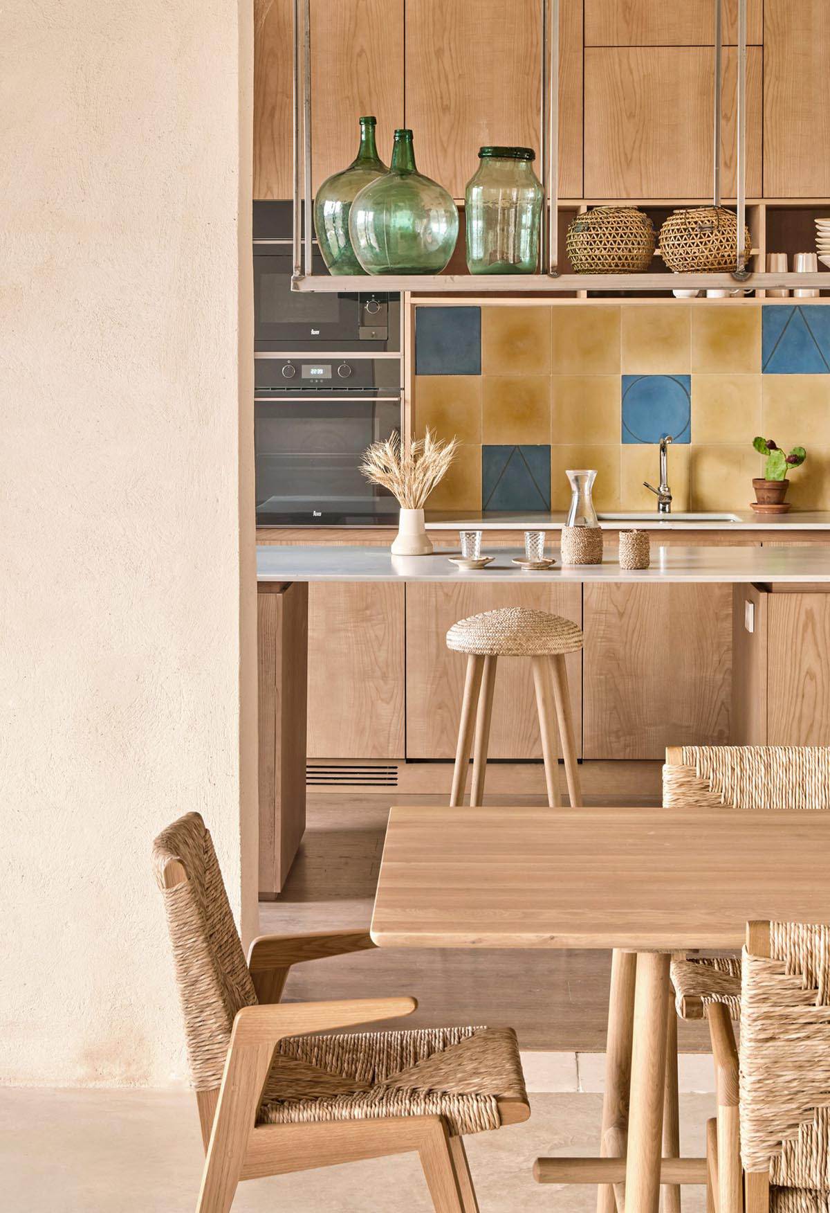 OHLAB's rural villa in Mallorca allows guests to frame natural surrounding under wattle pergola