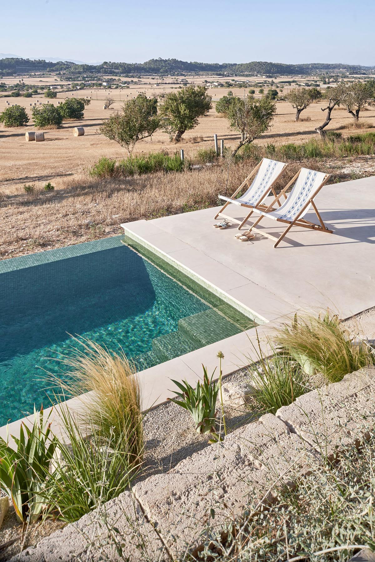 OHLAB's rural villa in Mallorca allows guests to frame natural surrounding under wattle pergola