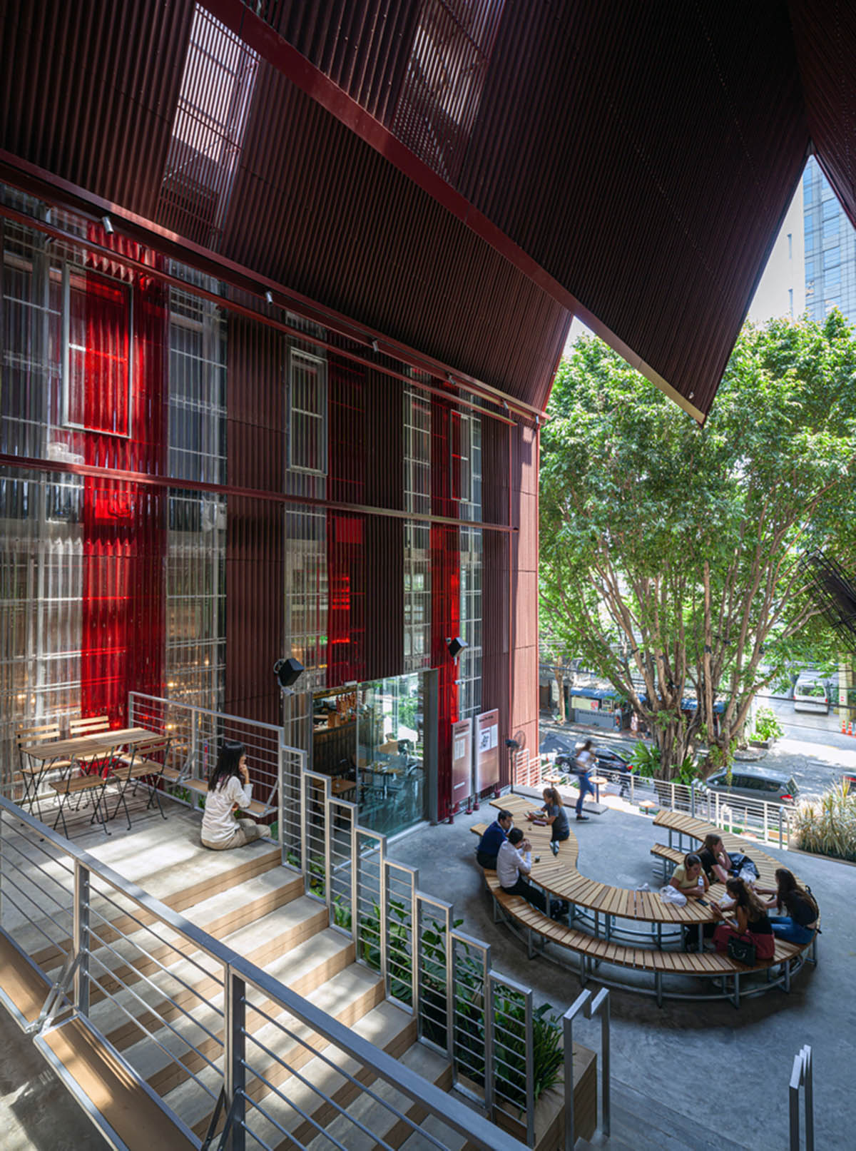 Department of ARCHITECTURE built pavilion with red transparent corrugated sheets for its roof