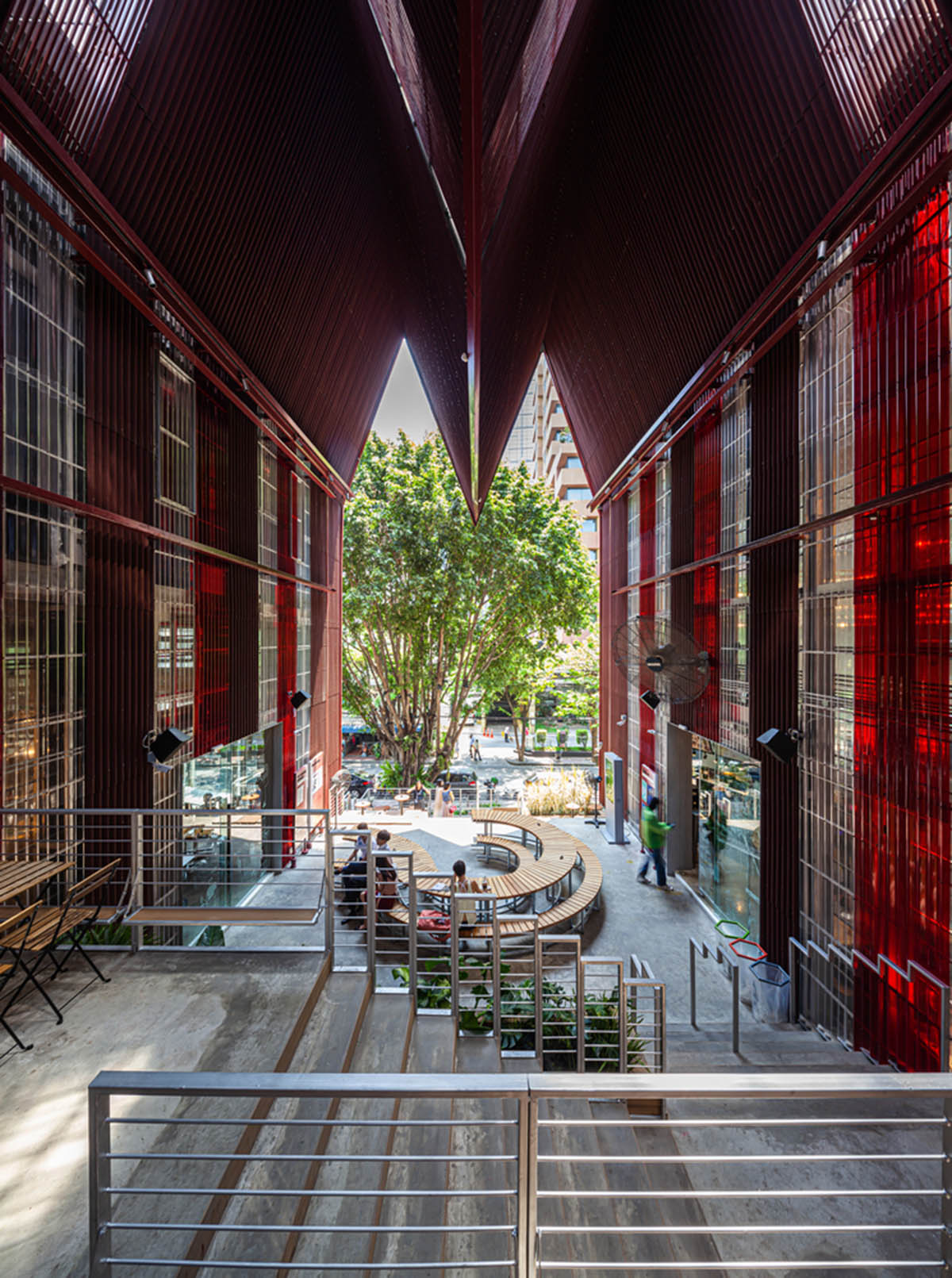 Department of ARCHITECTURE built pavilion with red transparent corrugated sheets for its roof