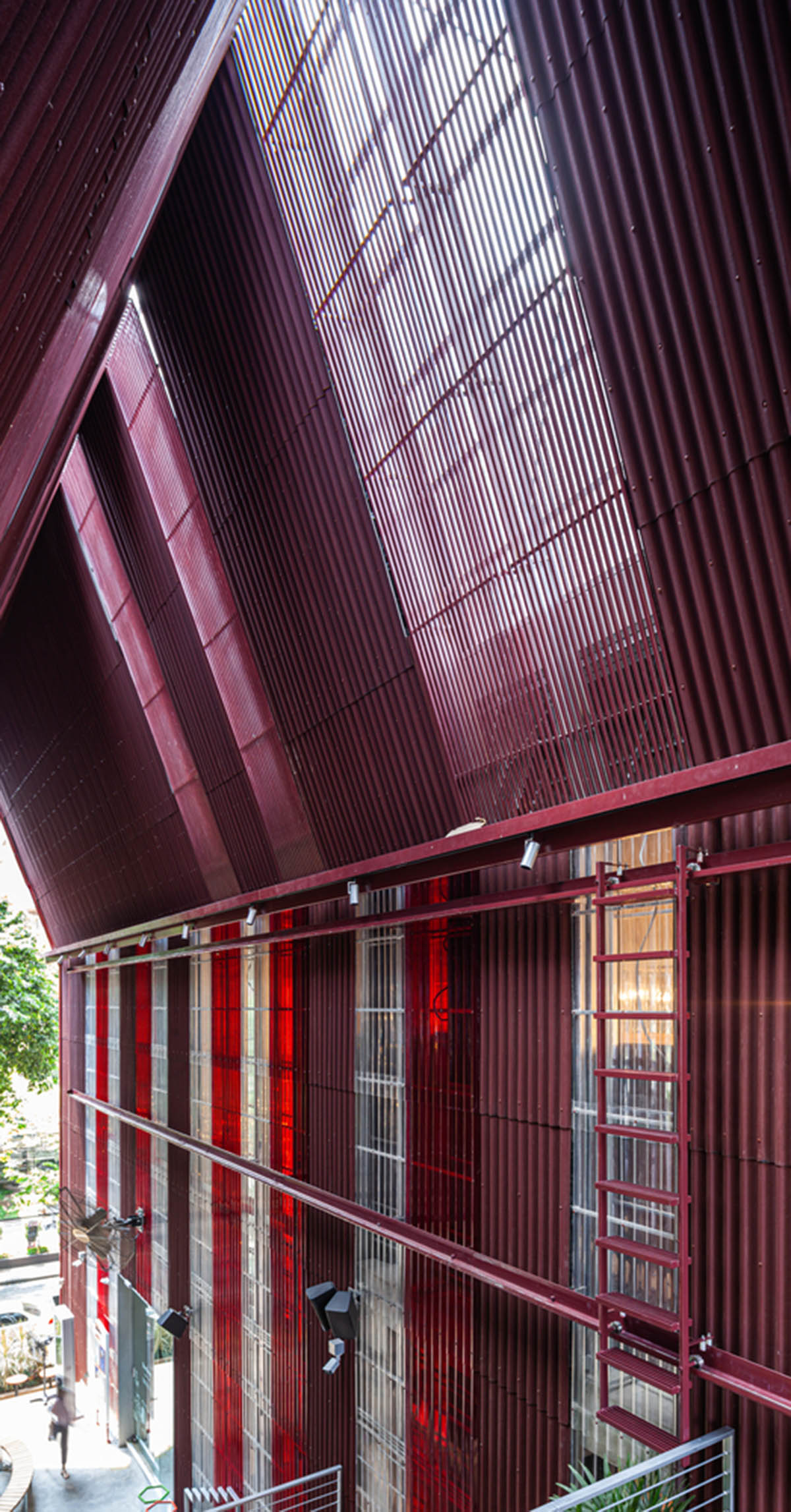 Department of ARCHITECTURE built pavilion with red transparent corrugated sheets for its roof