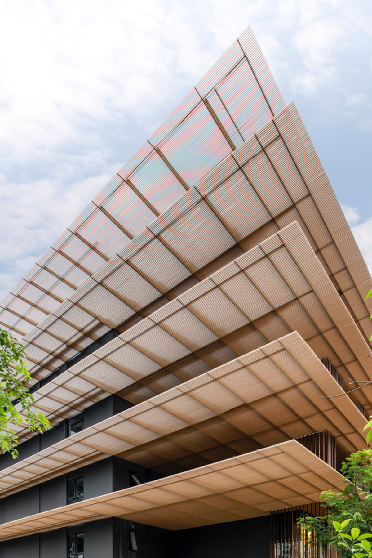 ACA Architects combines vertical timber screens with cantilevered aluminum screens for Thai resort