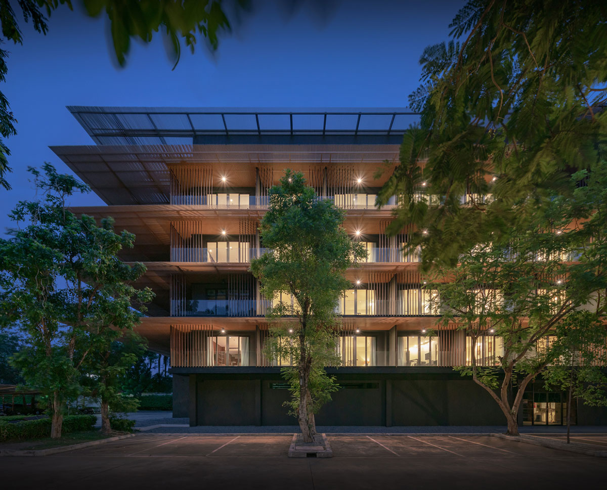 ACA Architects combines vertical timber screens with cantilevered aluminum screens for Thai resort