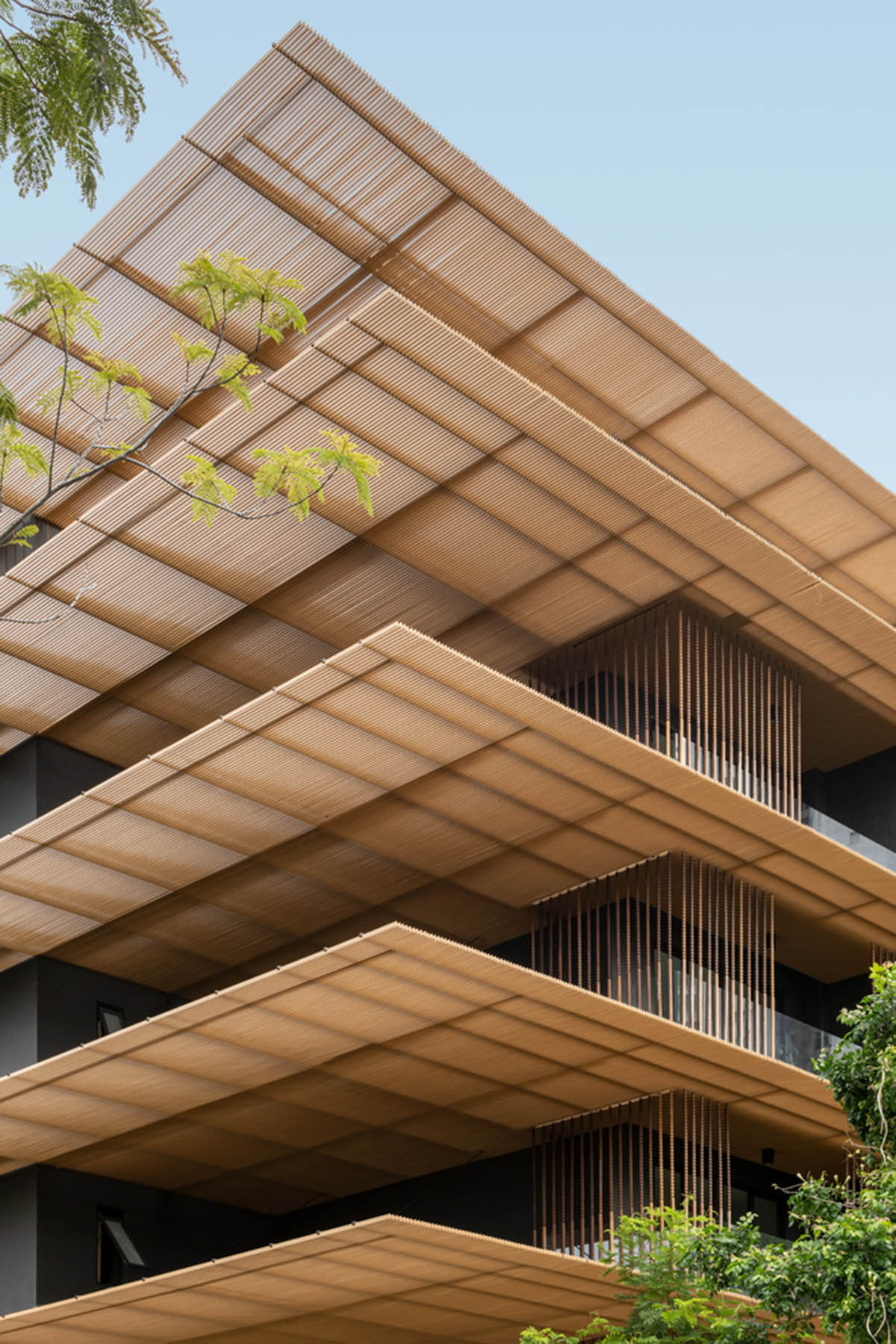 ACA Architects combines vertical timber screens with cantilevered aluminum screens for Thai resort
