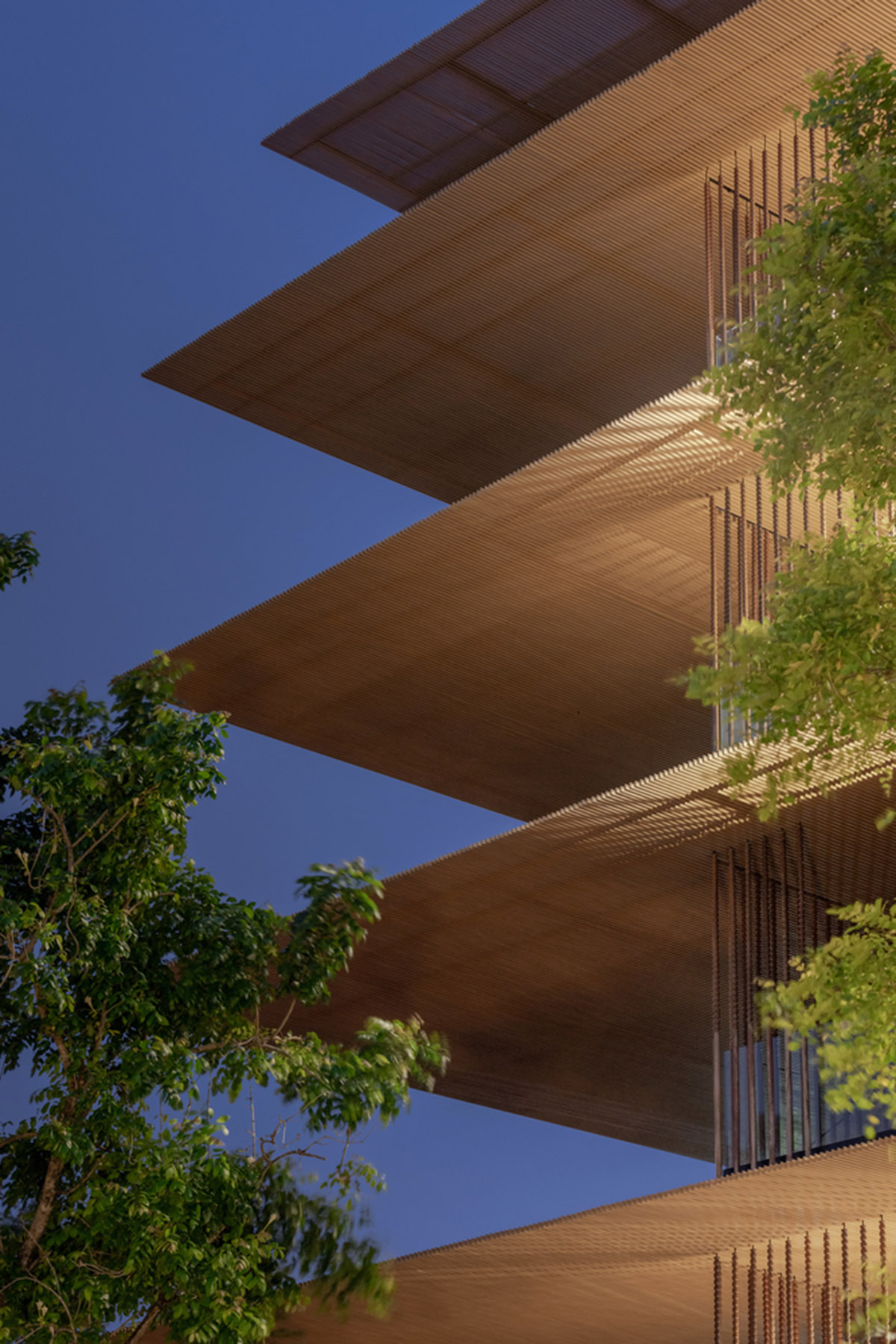 ACA Architects combines vertical timber screens with cantilevered aluminum screens for Thai resort