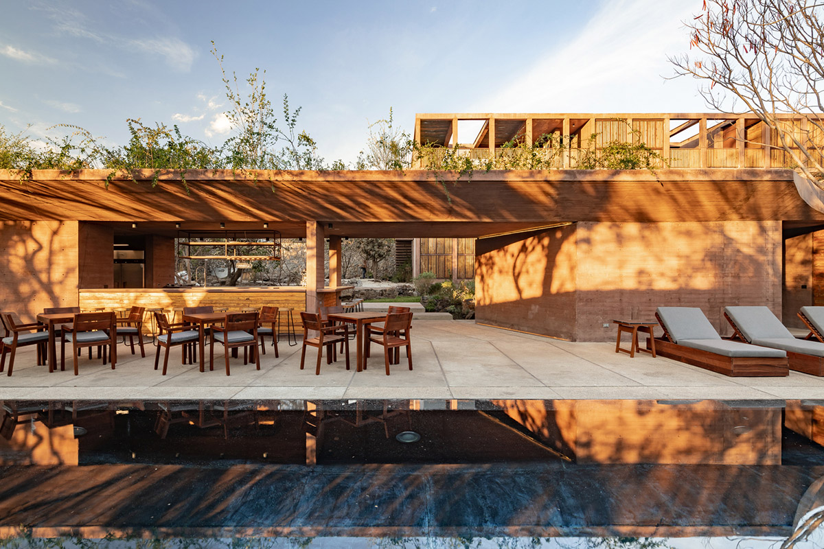 This gridded hotel made from pigmented concrete and volcanic stone sits on rugged terrain in Mexico