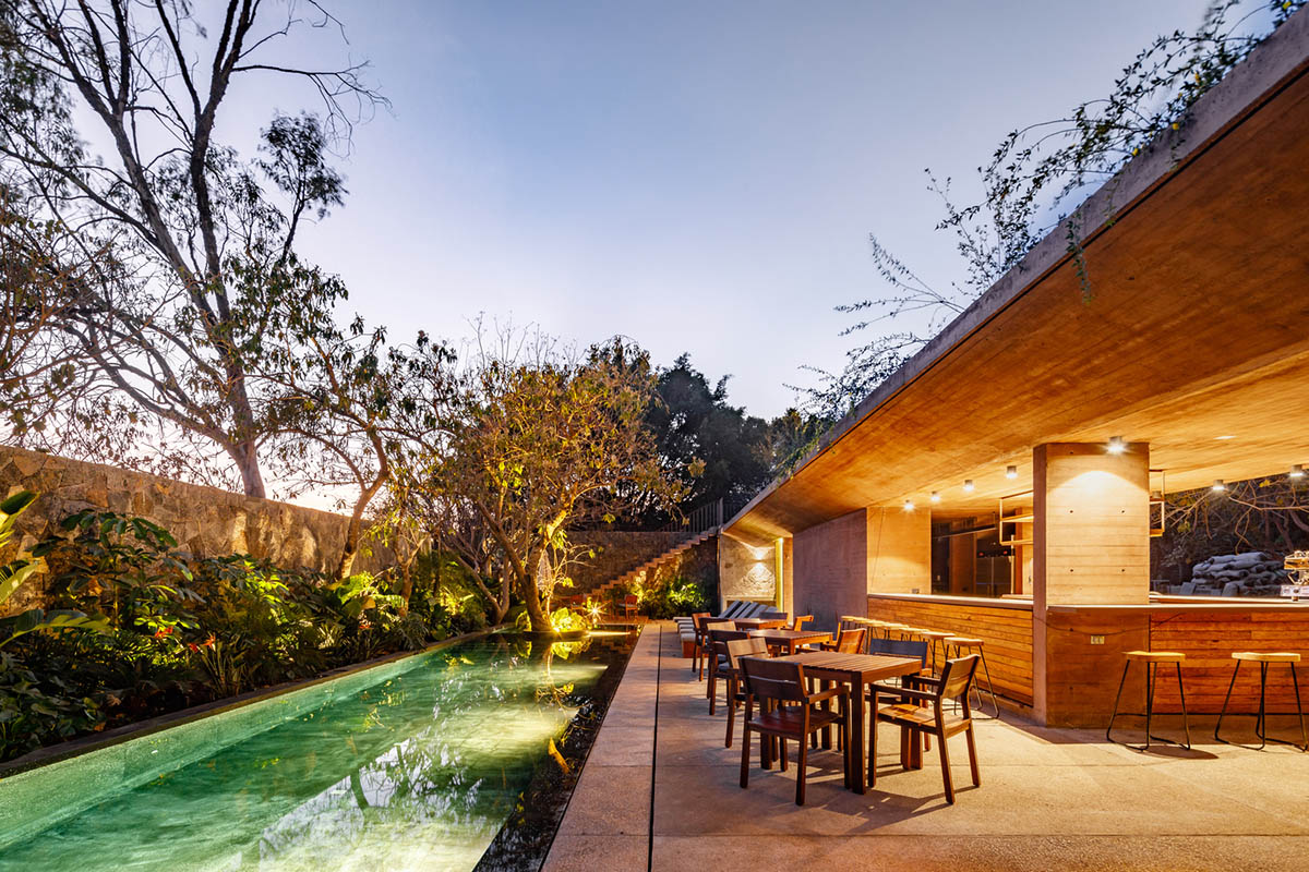 This gridded hotel made from pigmented concrete and volcanic stone sits on rugged terrain in Mexico