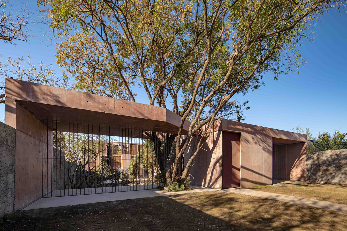This gridded hotel made from pigmented concrete and volcanic stone sits on rugged terrain in Mexico