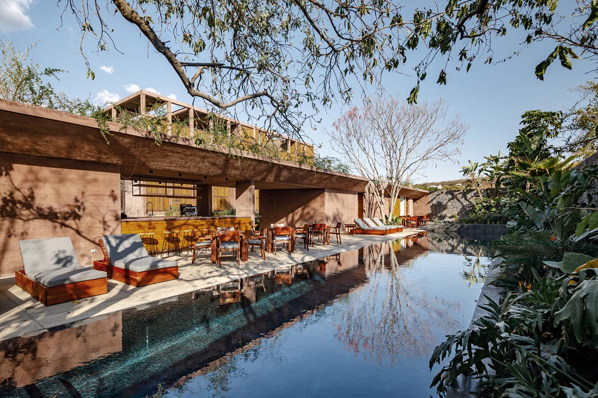 This gridded hotel made from pigmented concrete and volcanic stone sits on rugged terrain in Mexico