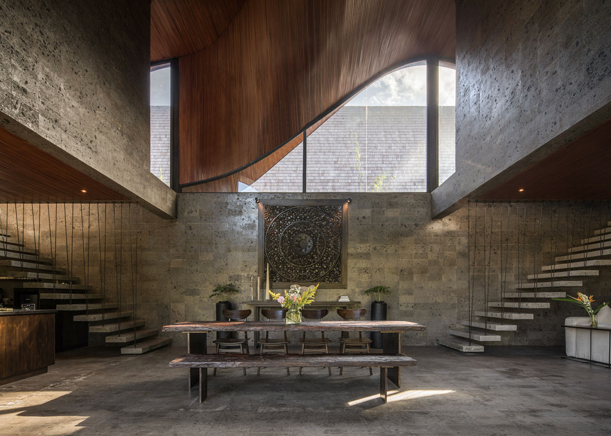 Twisted roof becomes walls and facade in Alpha House designed by Alexis Dornier in Bali