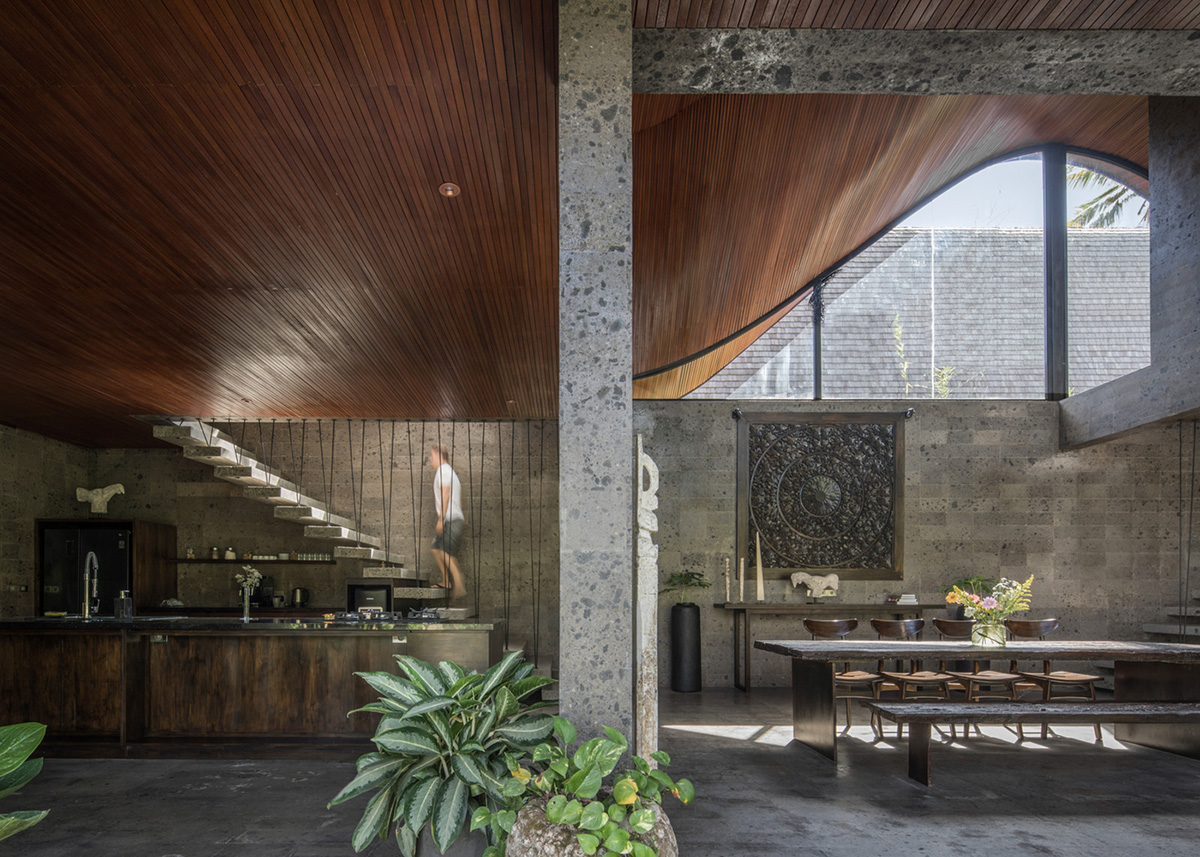 Twisted roof becomes walls and facade in Alpha House designed by Alexis Dornier in Bali
