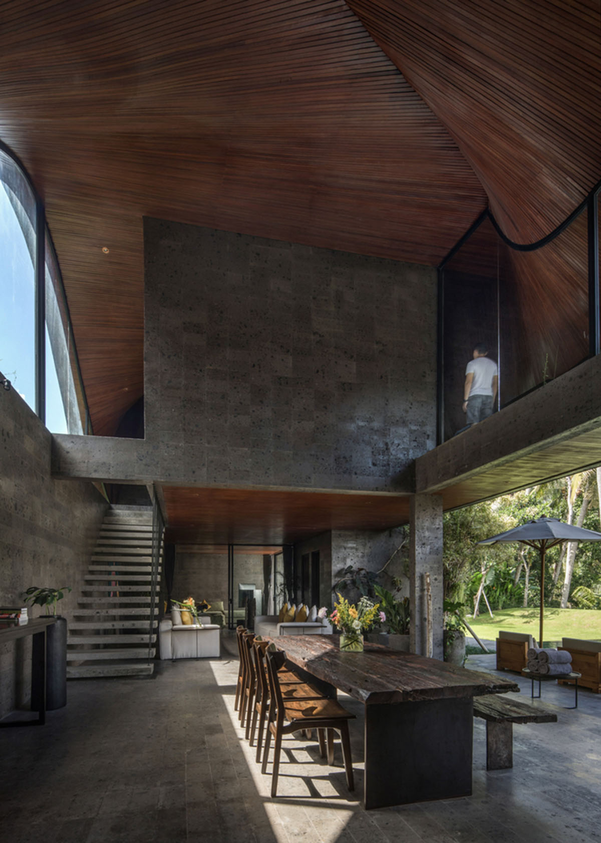 Twisted roof becomes walls and facade in Alpha House designed by Alexis Dornier in Bali