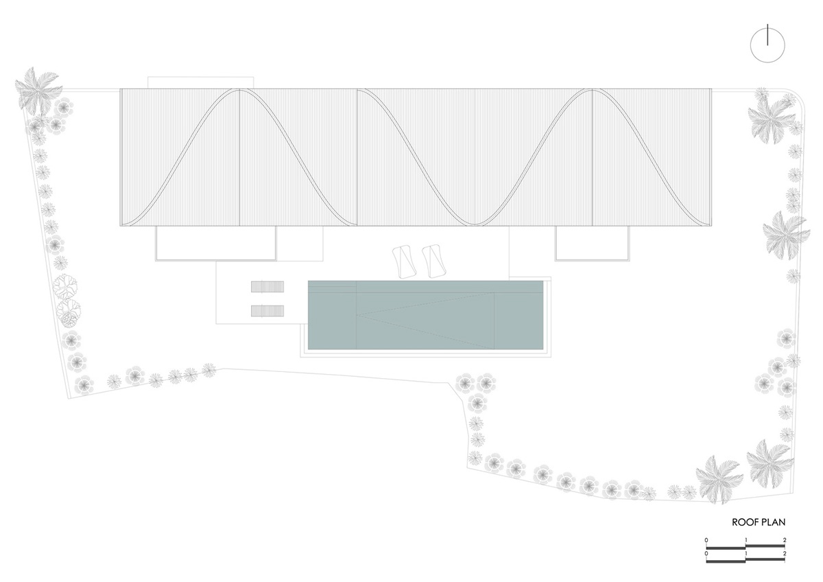 Twisted roof becomes walls and facade in Alpha House designed by Alexis Dornier in Bali