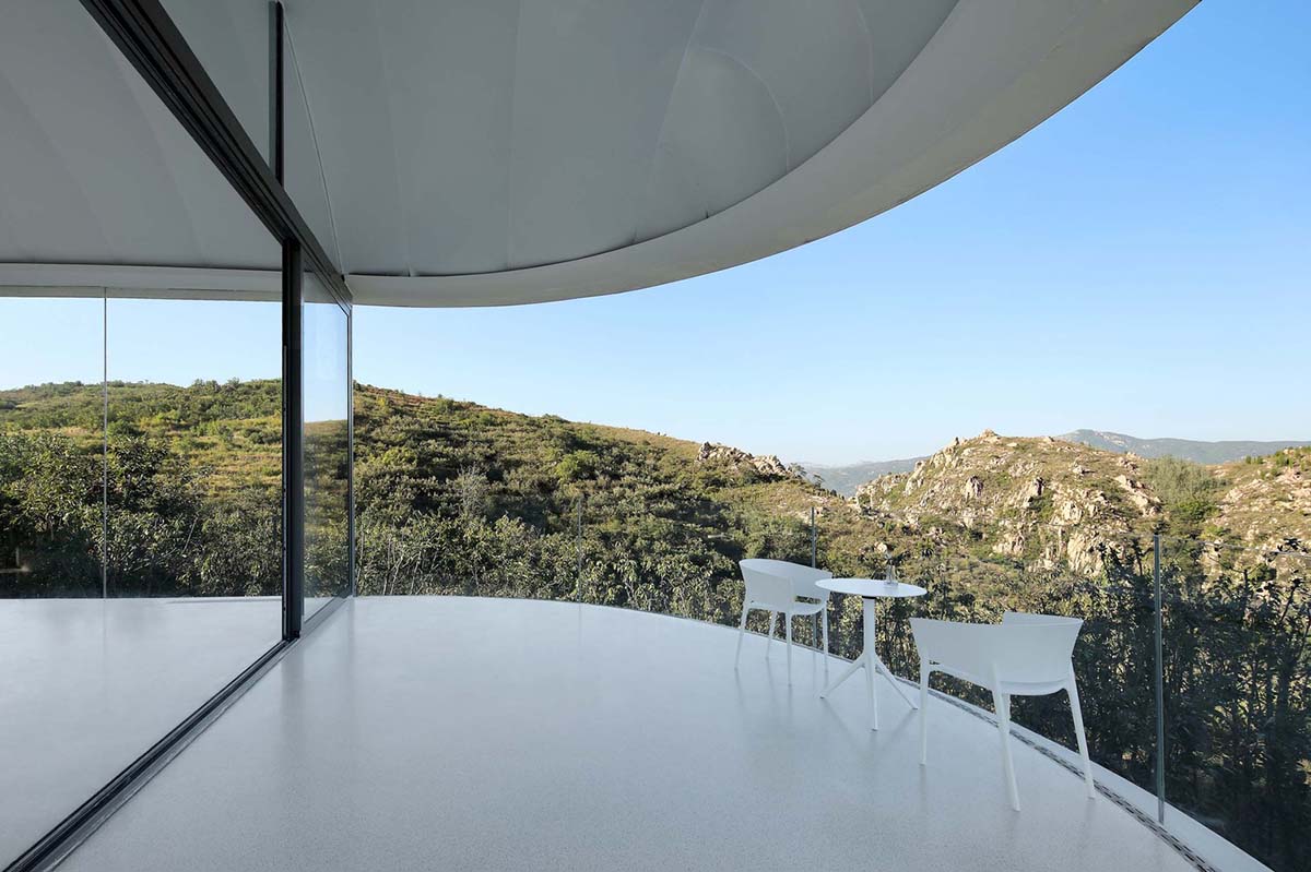 gad·line+ studio created could-like transparent and light reading space hovering in the mountains