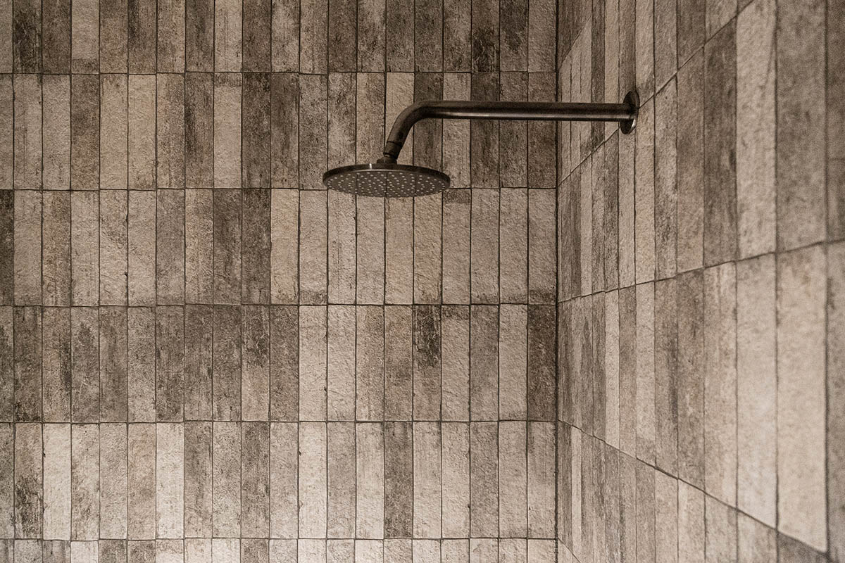 Splinter Society transforms former chocolate factory warehouse flat with earthy and rustic tones