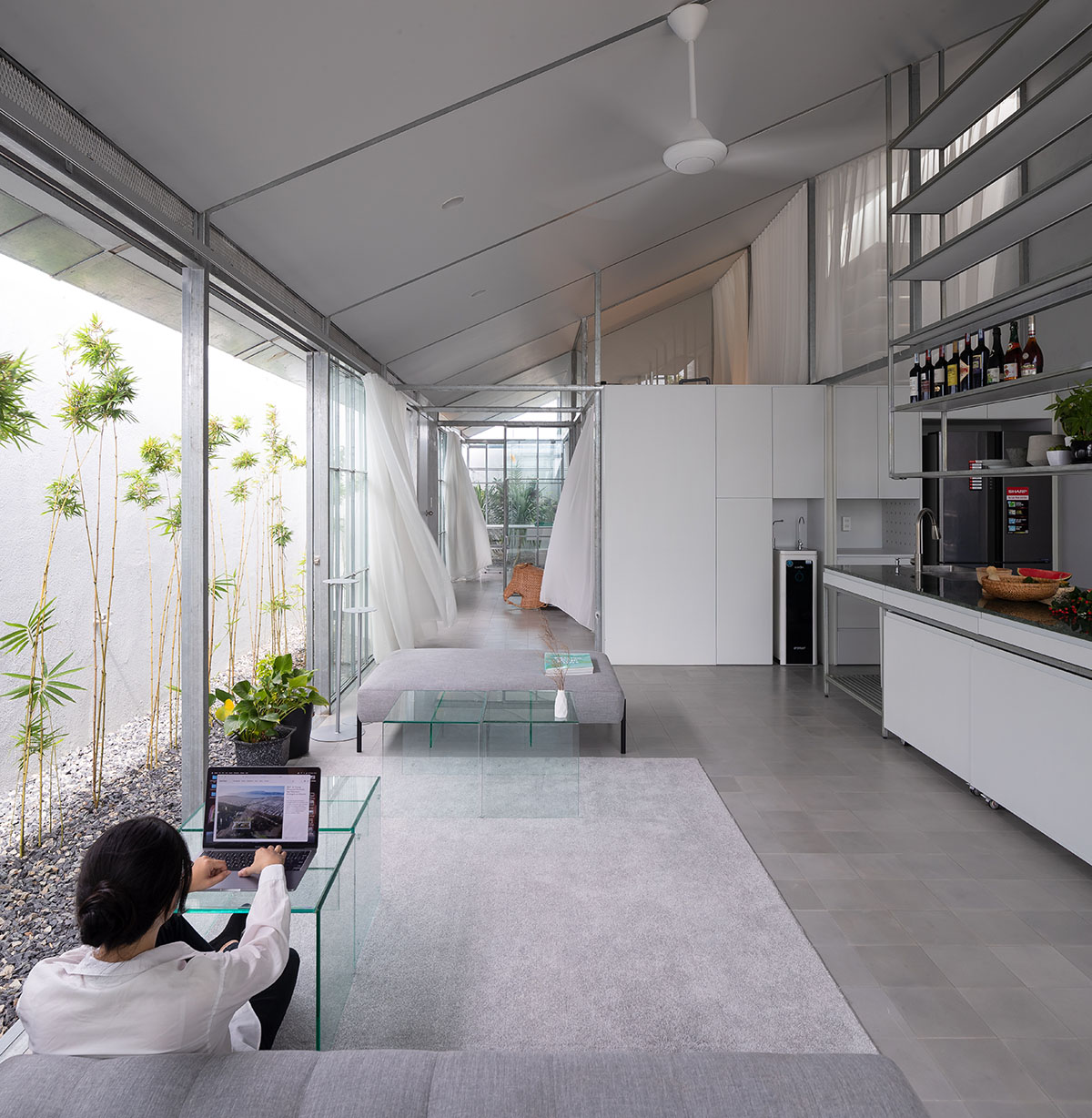 MIA Design Studio completes family house with angular roof in Vietnam 