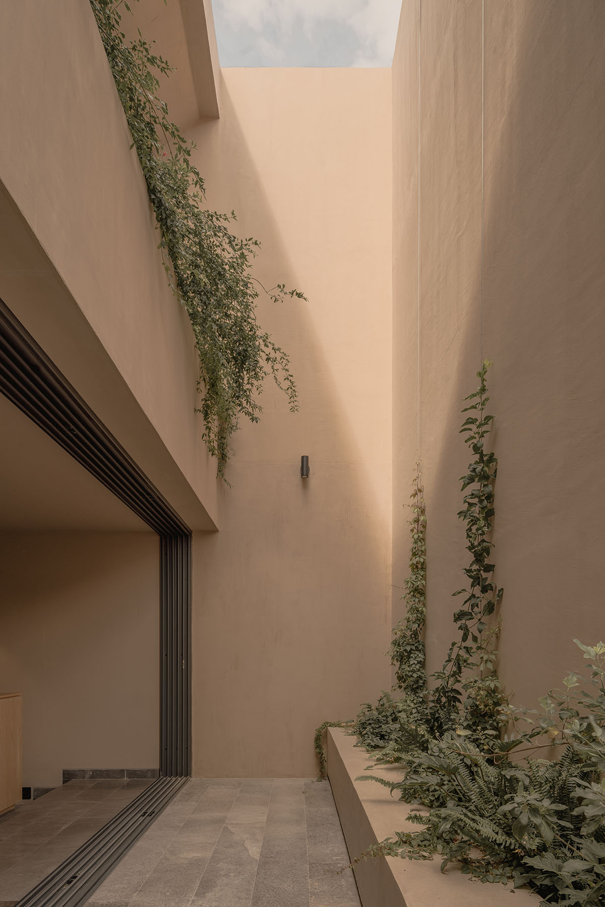 Taller Segovia Molina enriches beige Casa Aguilar with interior patios and an abundance of light