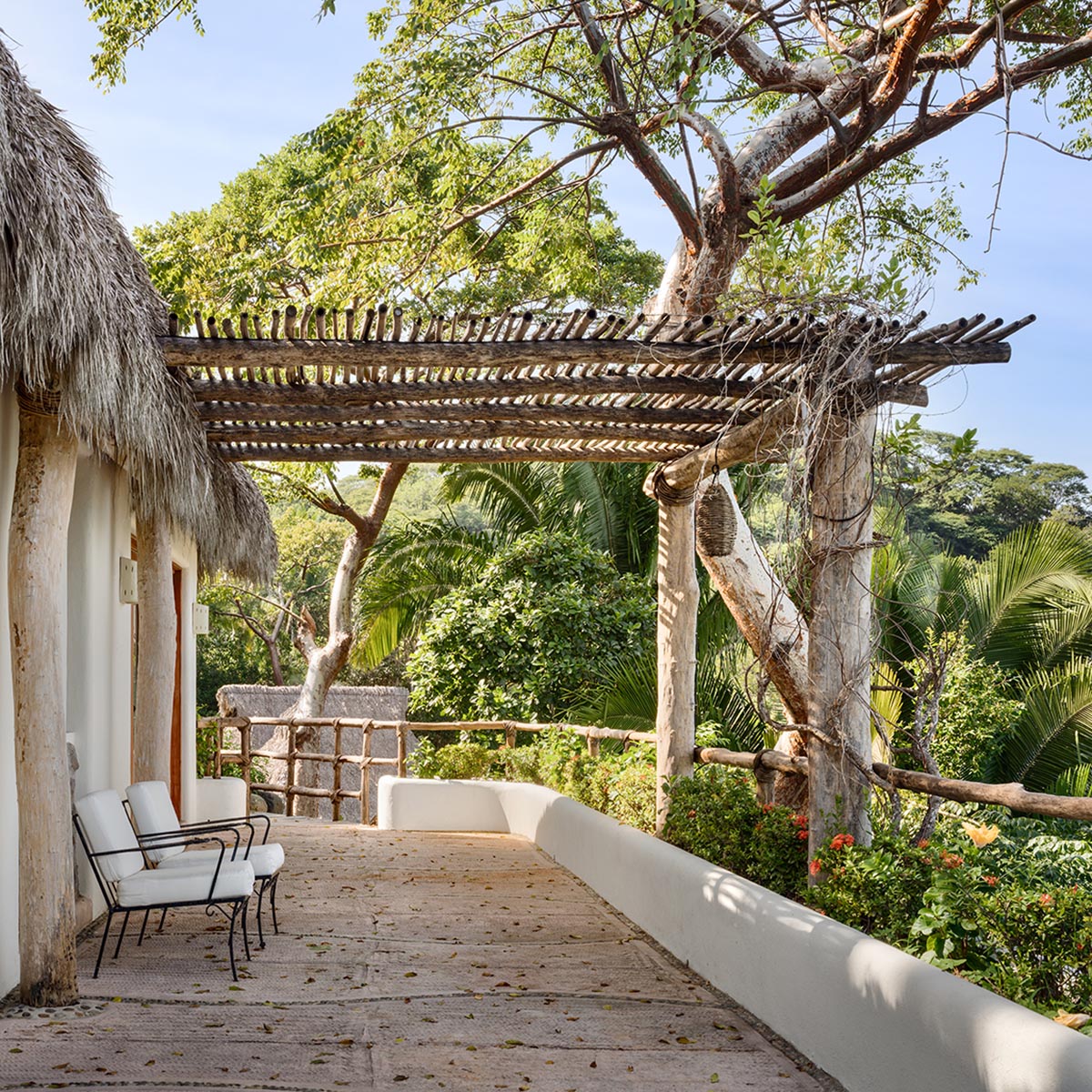 MAIN OFFICE adds half-circle yoga platform to thatched-roof guest villas in Sayulita, Mexico