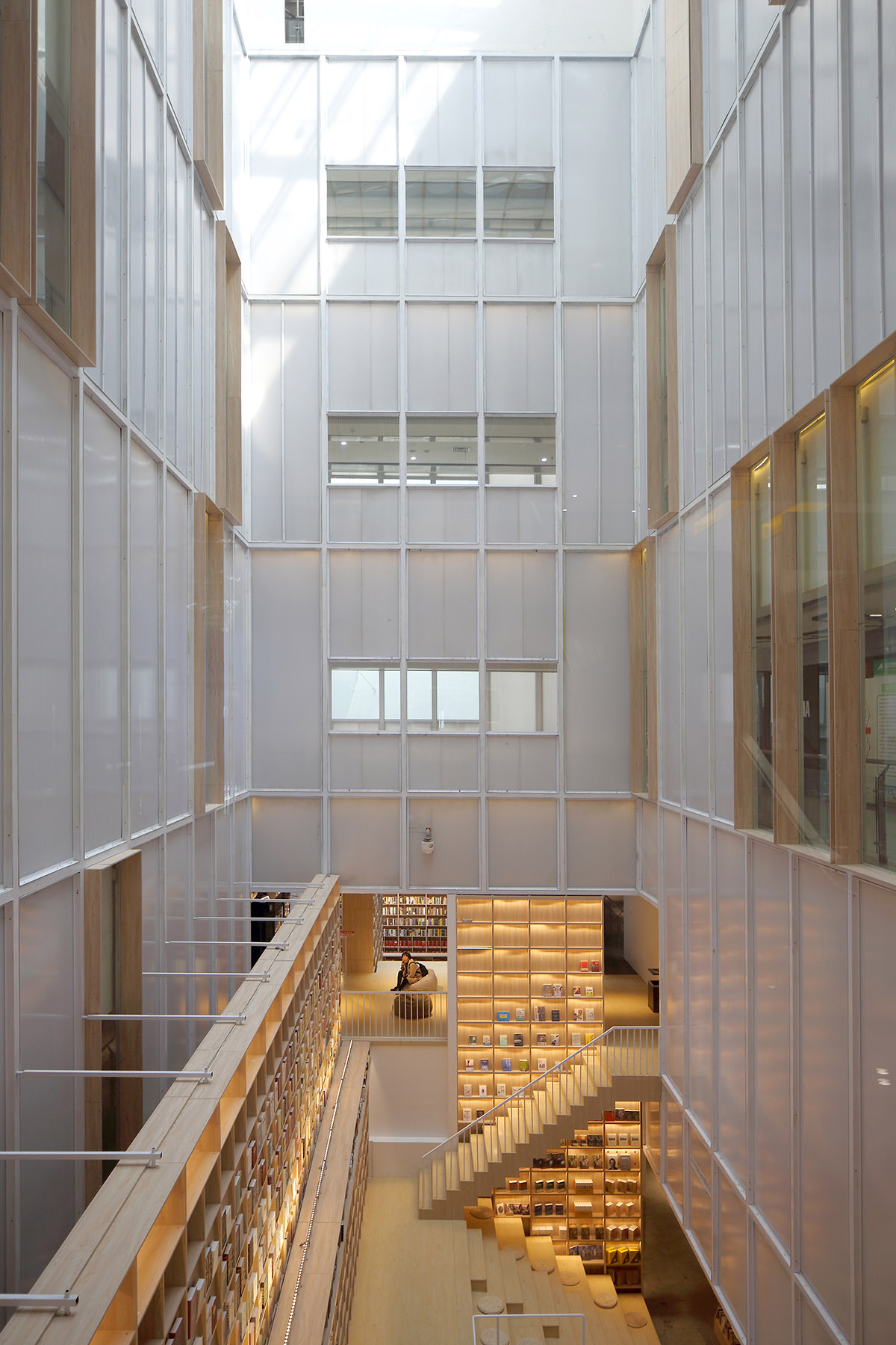 y.ad studio designs Yuanping Meijing Bookstore hidden in daylighting atriums in China