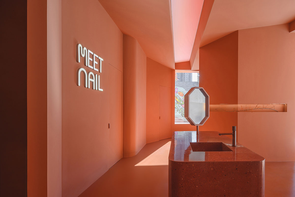 Bold peachy colors define interiors of nail flag store designed by 8877 Interiors in Shanghai 