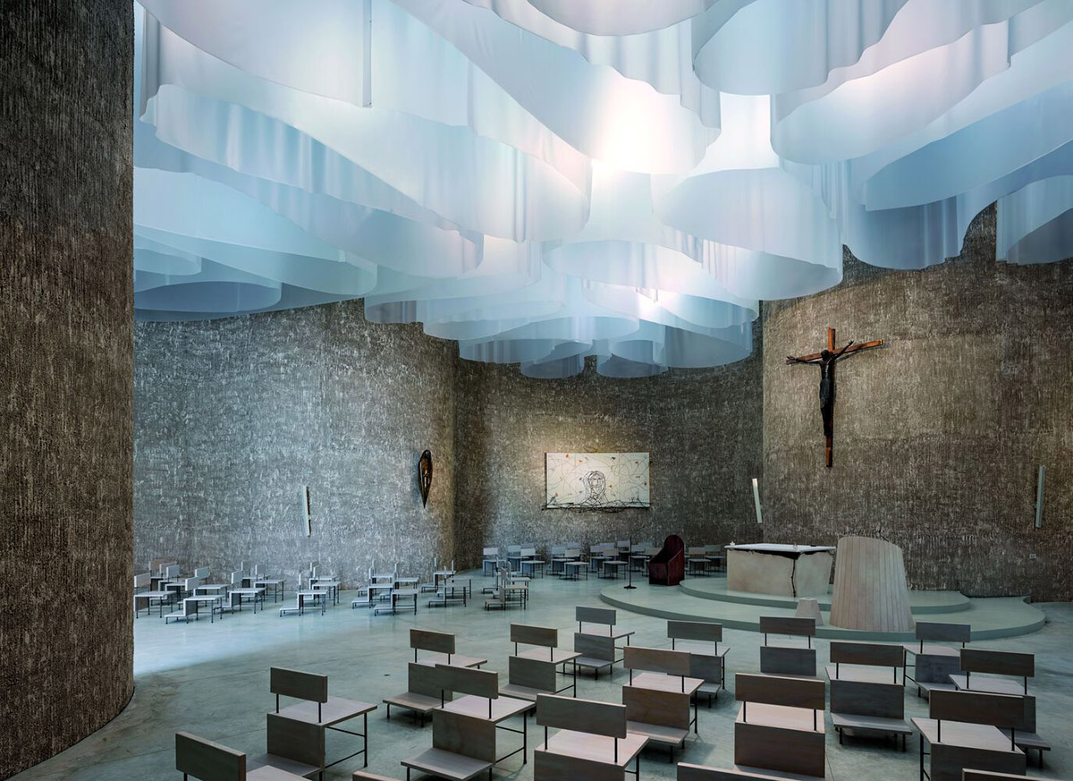 Smooth all-white walls form church designed by Mario Cucinella Architects in Mormanno hill town 