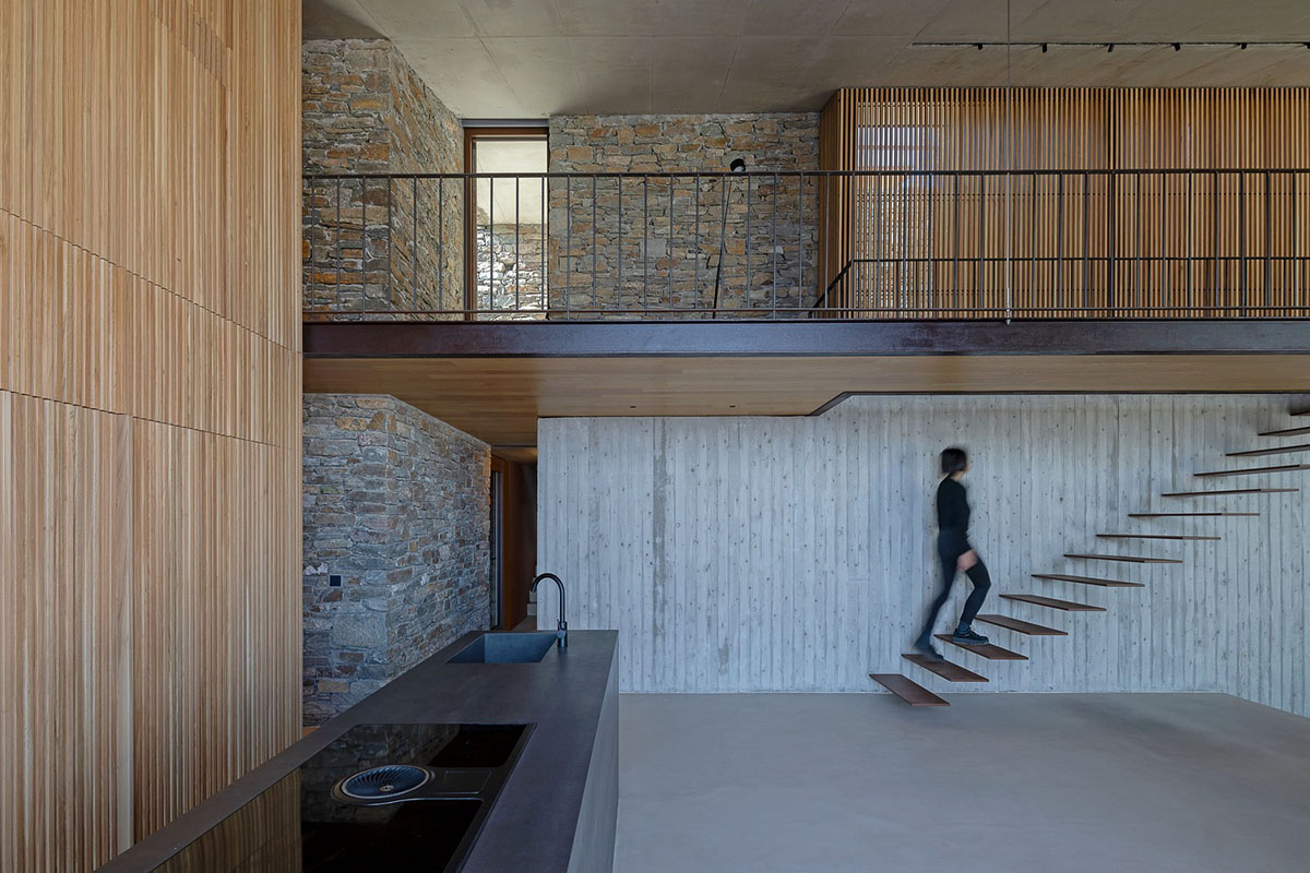 MOLD Architects used advantages of sloping land to design Ncaved house in Greece