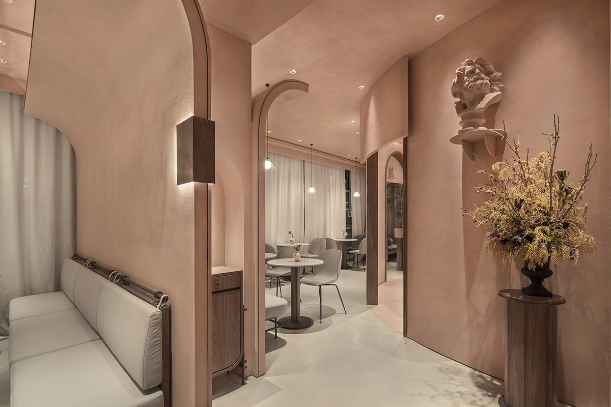 S&ograve; Studio combines metallic and pinkish-colored interior for Beijing store