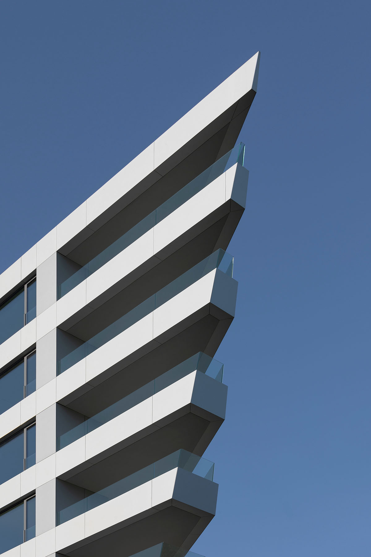 Sharp triangular balconies define this residential block designed by STARH in Bulgaria