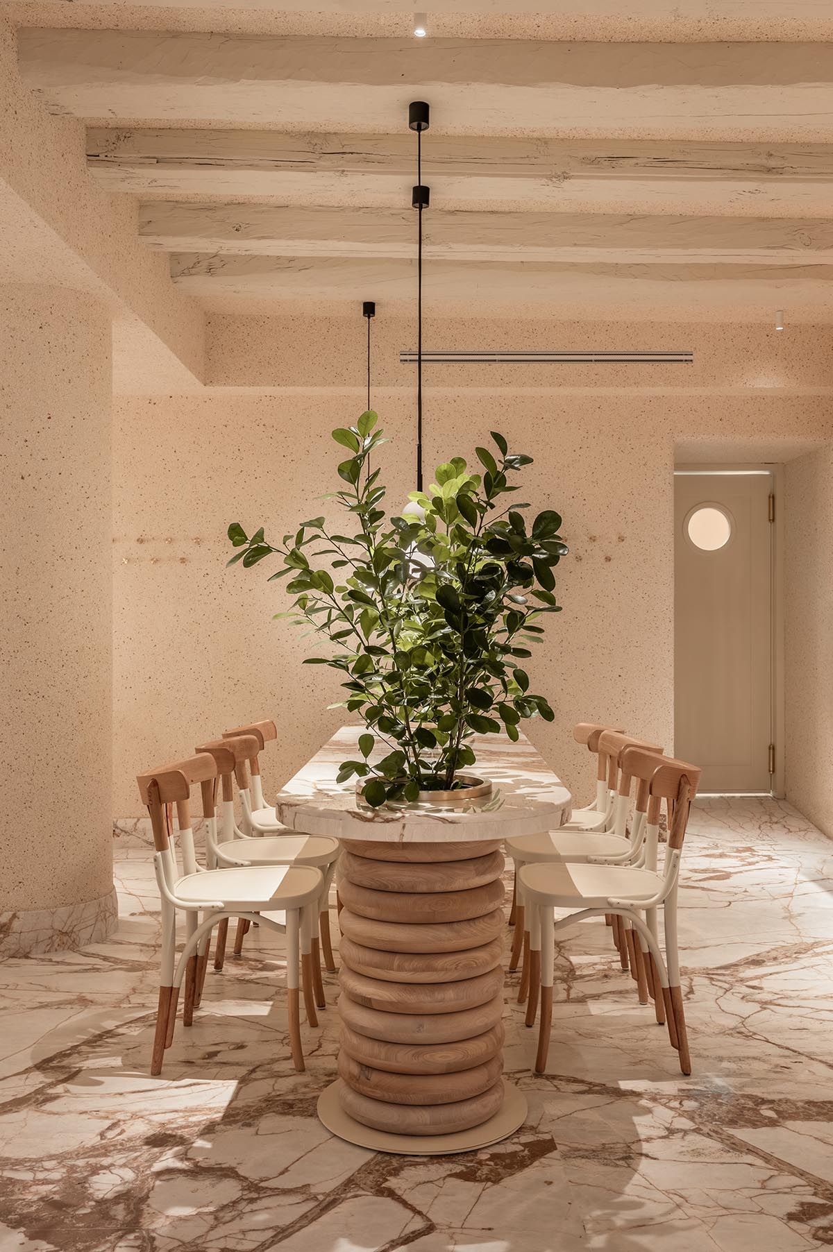 YOD Group clads the walls of a pastry shop in eggshell plaster in Lviv, Ukraine