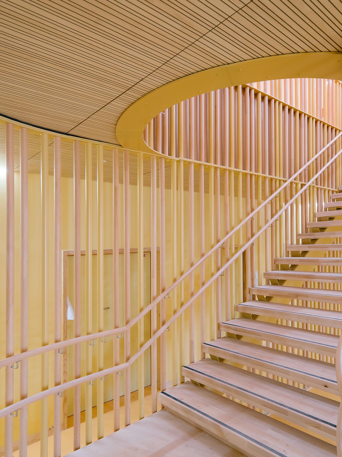 Wooden school by r2k architecte is inspired by Nordic architecture to be a positive energy building