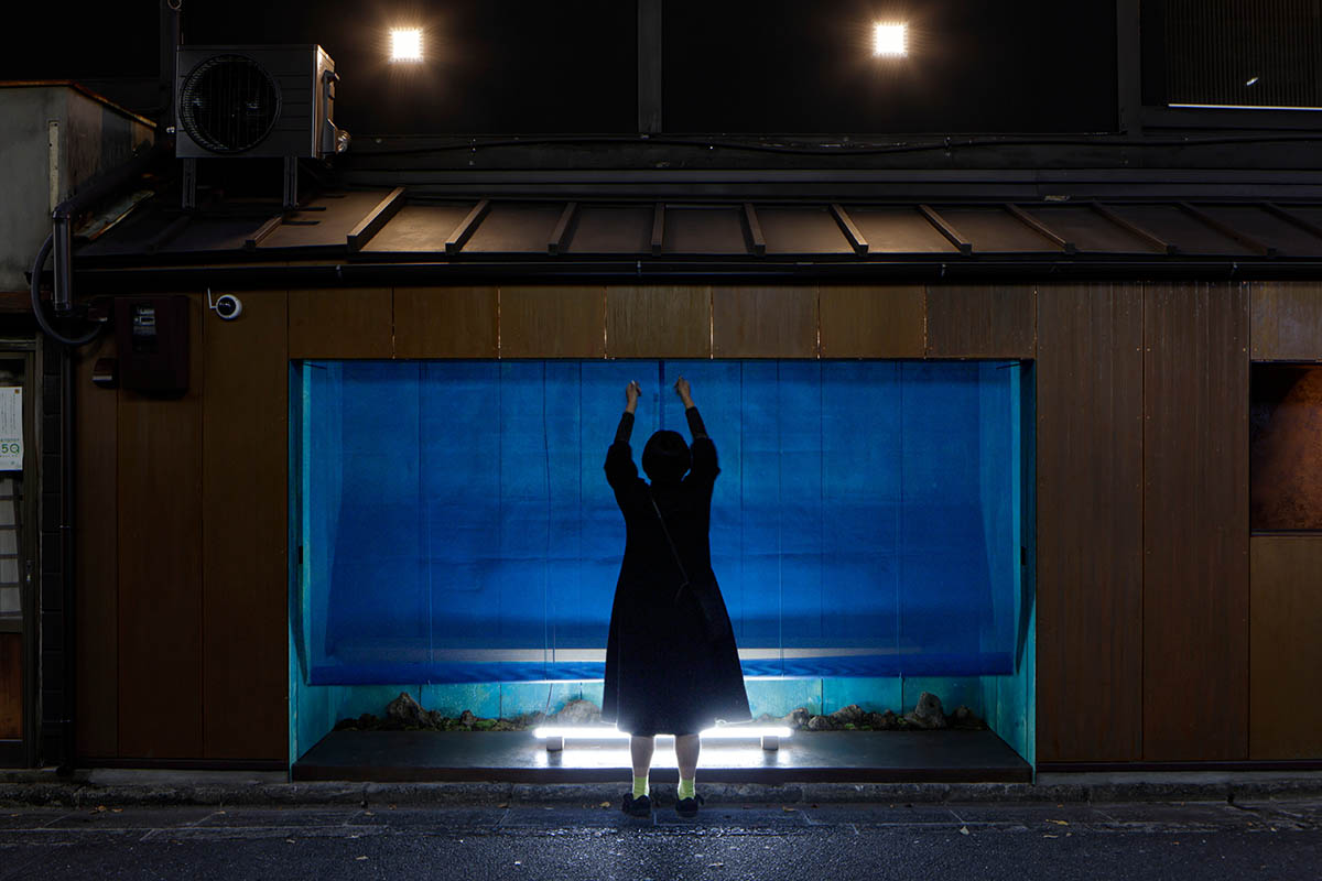 The one-meter-deep cafe invites customers with its patina color on its facade in Kyoto