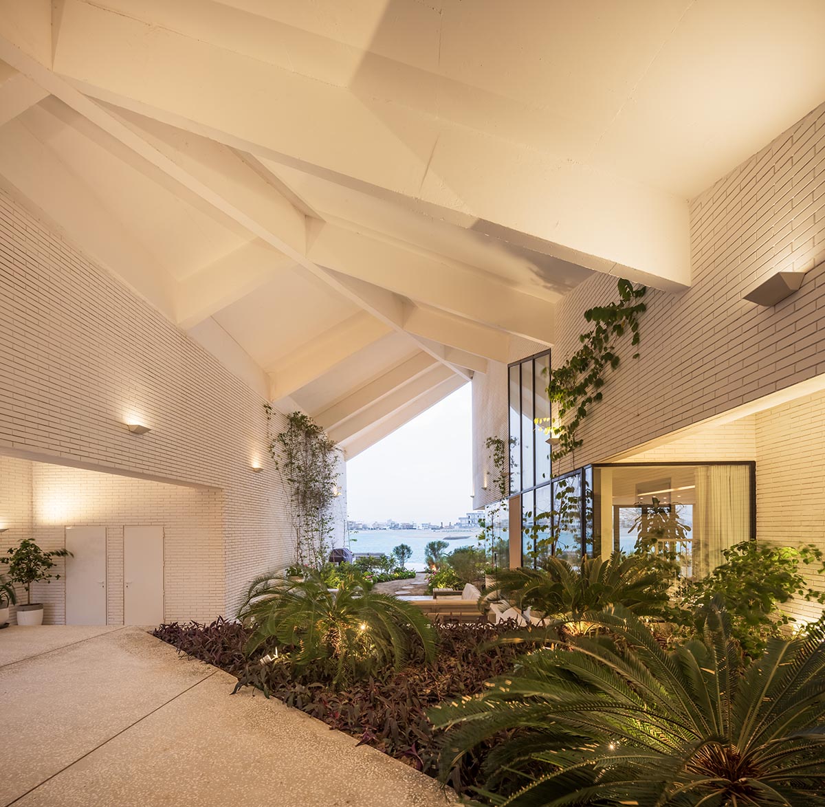 Family house is covered by folded roof to create a tent-like structure on Kuwait's seaside 
