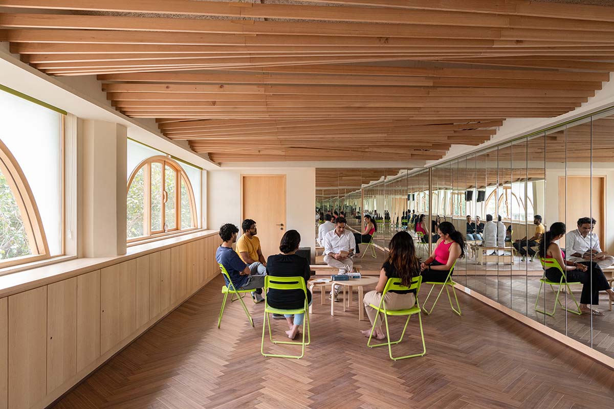 studio Hinge embeds a library under the wooden tree-like canopies in Mumbai