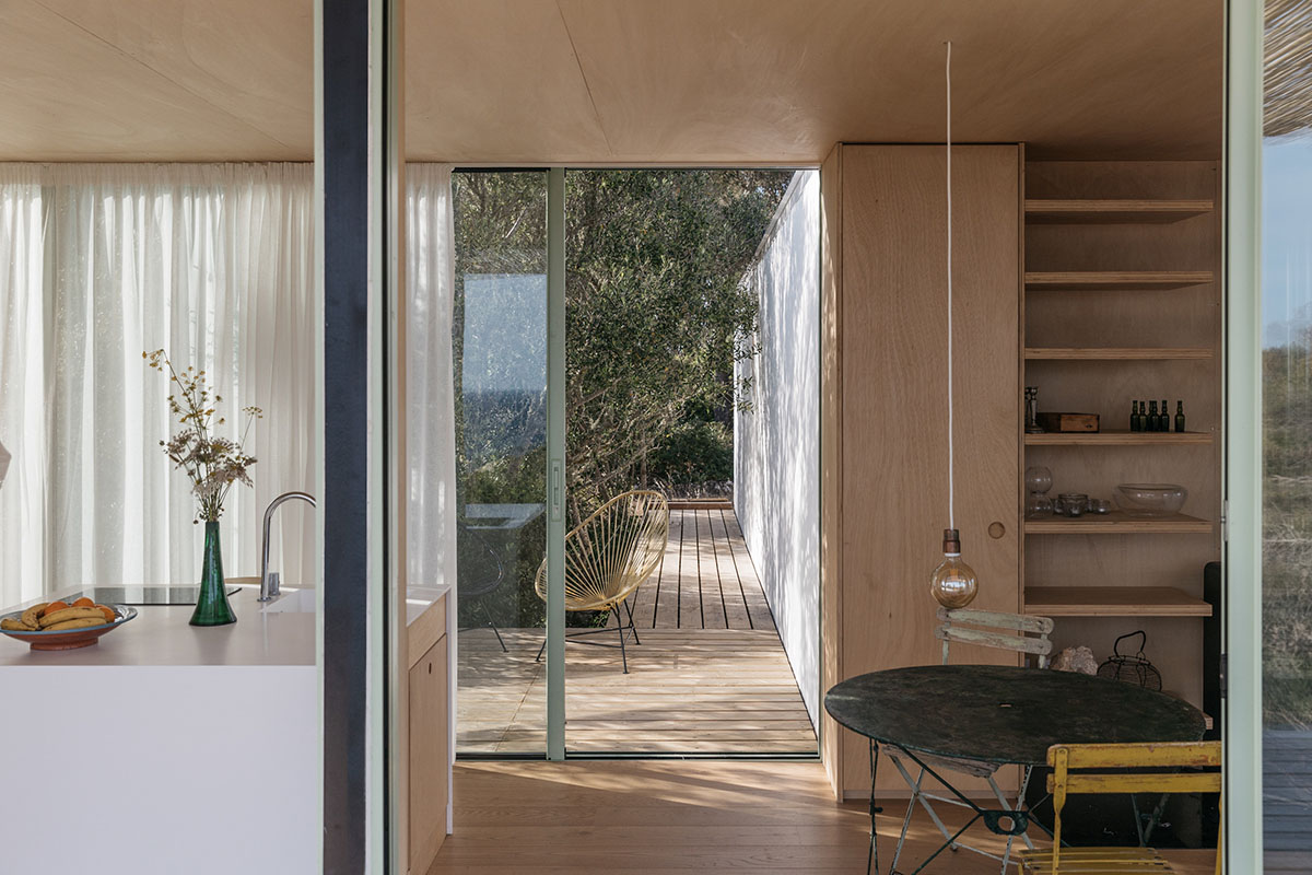 Ignacio de la Vega and Pilar Cano-Lasso create T-shaped cabin framing views from the Mediterranean