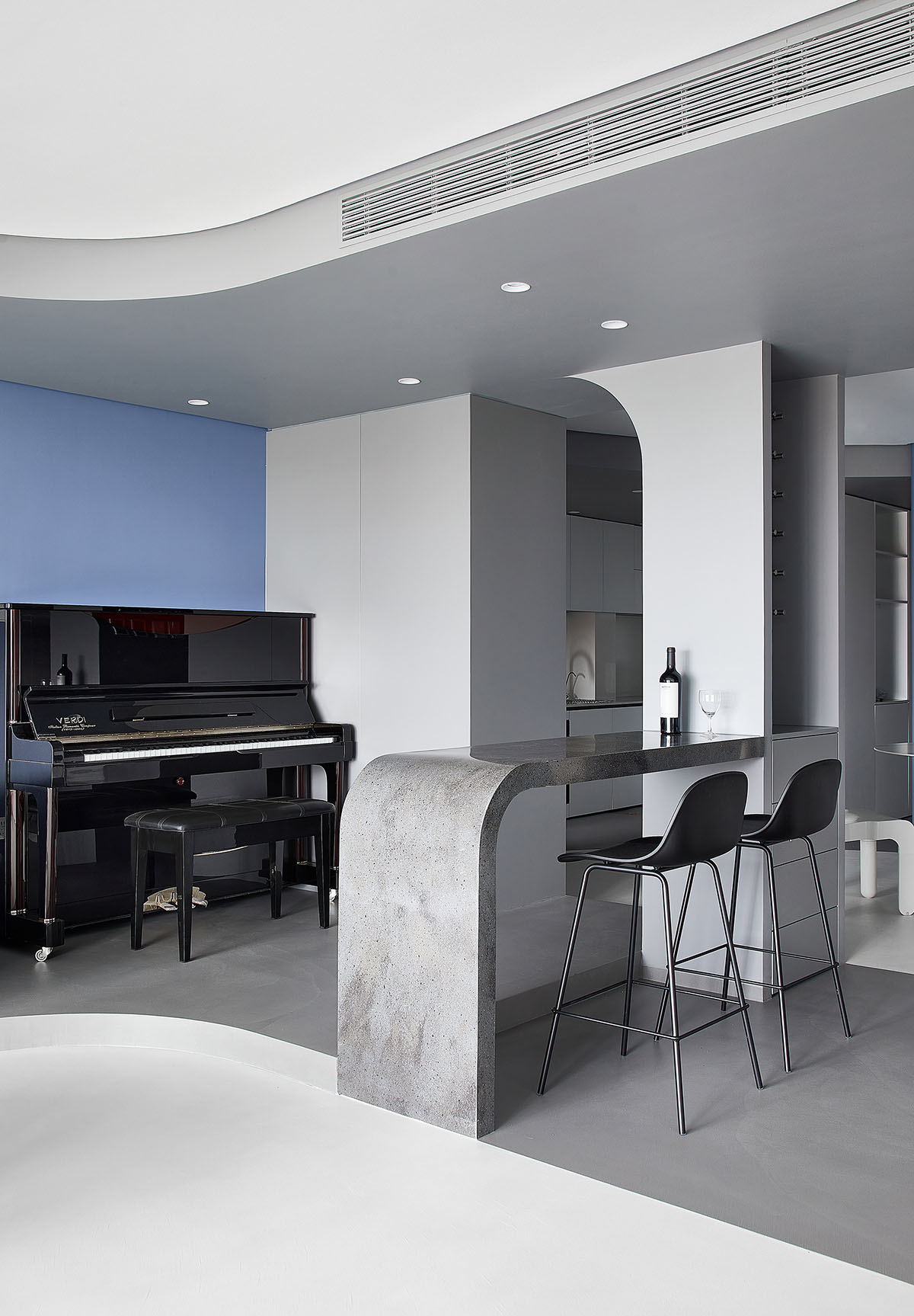 XIGO STUDIO creates gray and blue-colored interiors for apartment in Beijing 