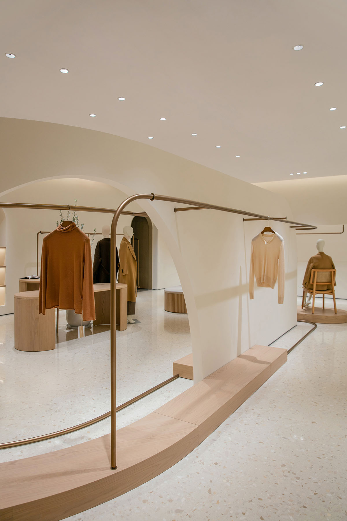 JYDP designs retail space with warm tones and curved walls in Shanghai