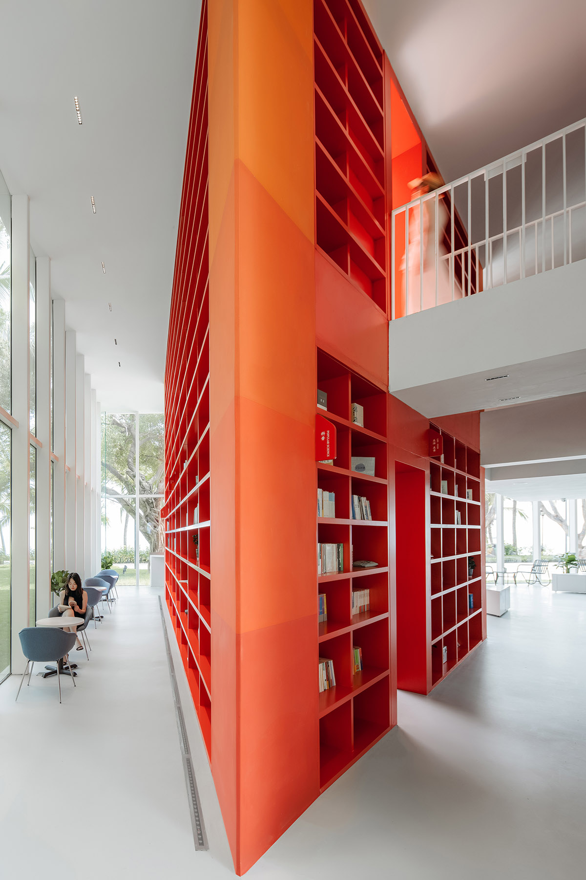 Wutopia Lab elaborates bookstore with red triangular bookshelves for Tianya Books in China 