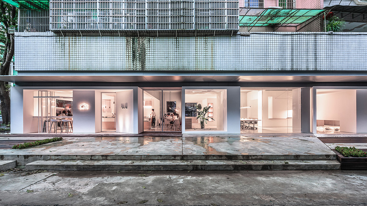 Lukstudio plays with cut-out volumes to transform old Chinese building into cafe and office