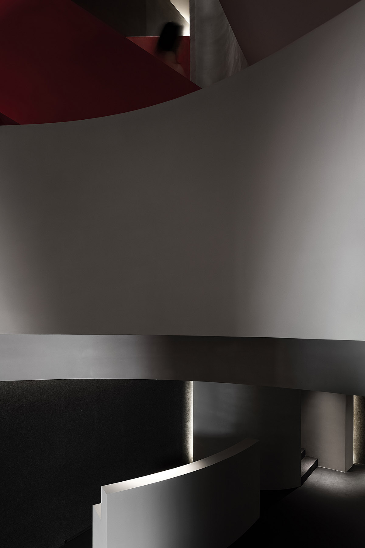 A beauty salon by AD ARCHITECTURE features dark-hued interiors drawing inspiration from cells