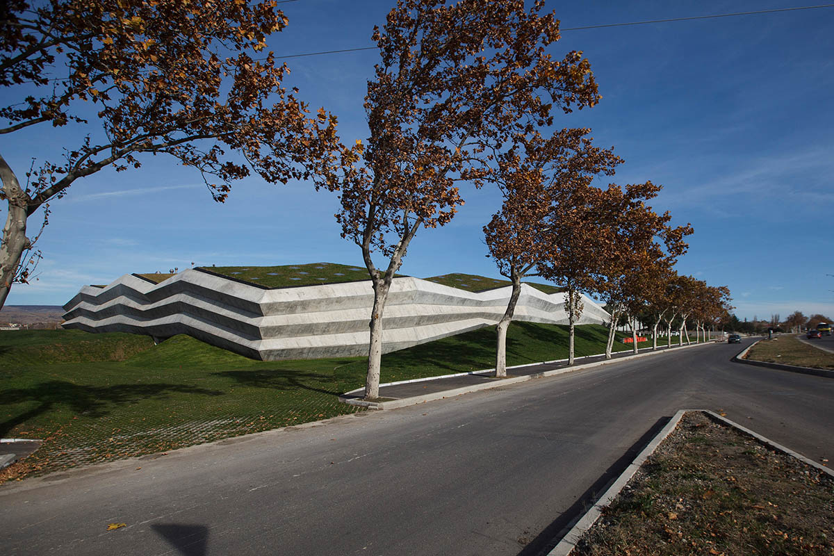 Folded concrete shell wraps coffee production plant by Giorgi Khmaladze Architects in Tbilisi