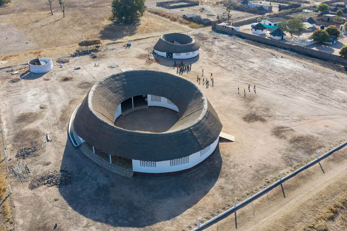 Toshiko Mori built Fass School and Teachers’ Residence featuring wavy thatched roof in remote Senegal