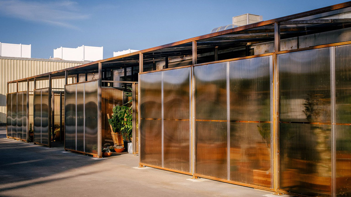 Part Office and cactus store design greenhouse with tinted polycarbonate panels in Santa Monica