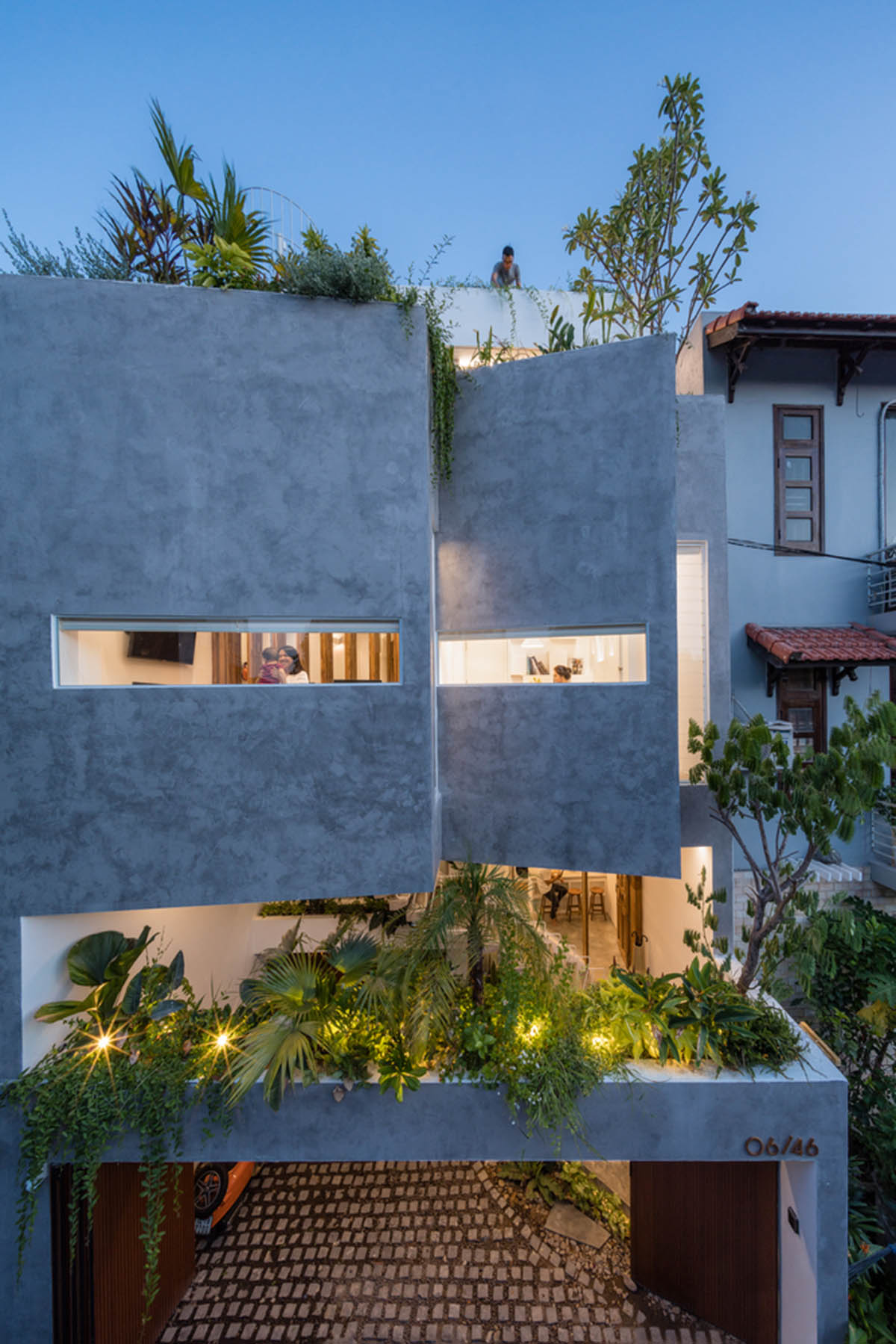 Jalousie House in Vietnam features porous wall with folding pattern for airy interior