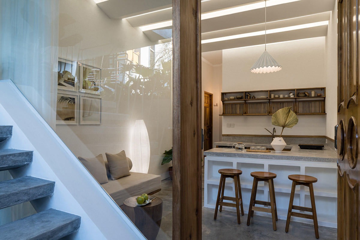 Jalousie House in Vietnam features porous wall with folding pattern for airy interior