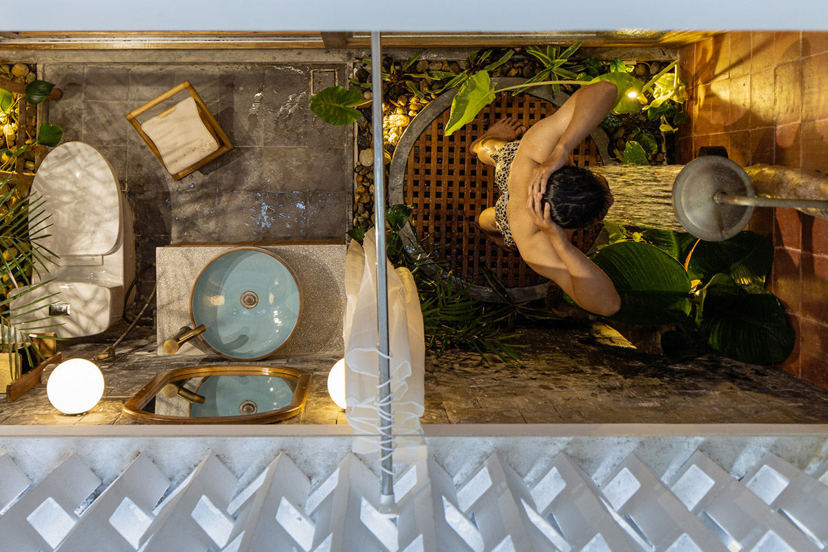 Jalousie House in Vietnam features porous wall with folding pattern for airy interior