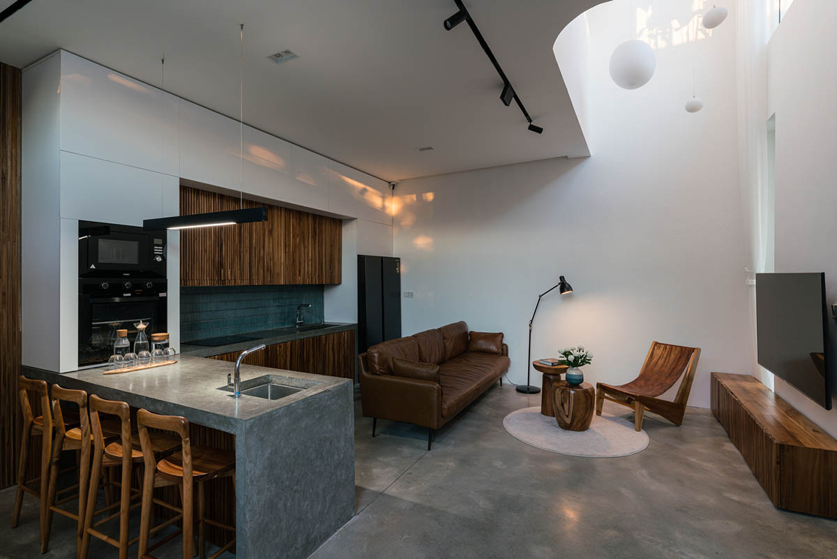 Jalousie House in Vietnam features porous wall with folding pattern for airy interior