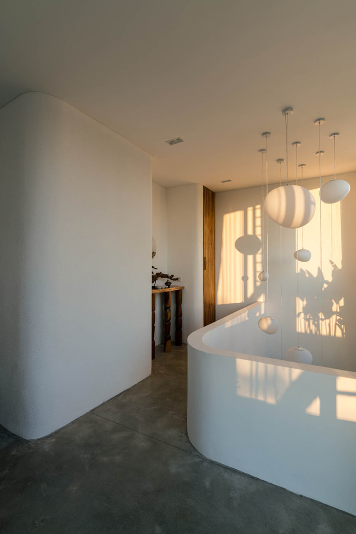 Jalousie House in Vietnam features porous wall with folding pattern for airy interior