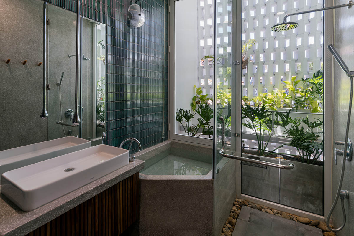 Jalousie House in Vietnam features porous wall with folding pattern for airy interior